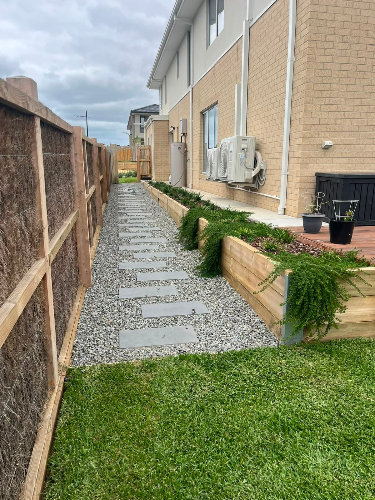 Stepping stone pathway with turf and garden beds